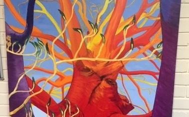 Red, yellow and purple abstract painting of a tree