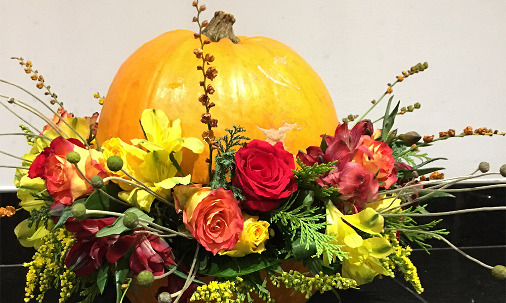 Autumnal flower arrangement with pumpkin