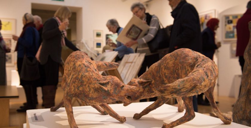 Sculpture of two brown foxes at Art exhibition