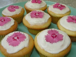 Cupcakes decorated with pink flowers