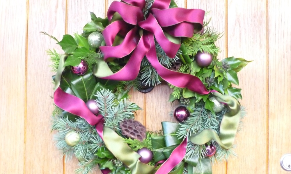 Purple and green christmas wreath with baubles