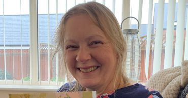 Author holding her book