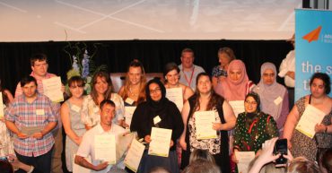Group of adult learners at awards ceremony