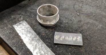 Silver ring and metal strips