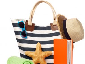 Beach bag, hat, sunglasses, starfish and book