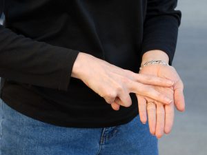 Hands making sign language symbol