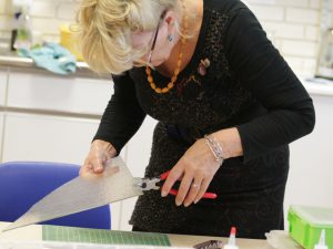 Woman cutting glass