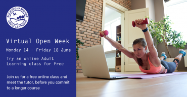 Woman practising a fitness class with a laptop