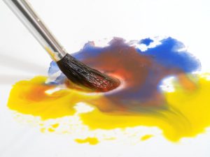 watercolour paints and paintbrush