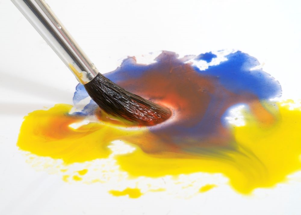 watercolour paints and paintbrush