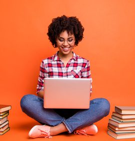 woman with laptop and books